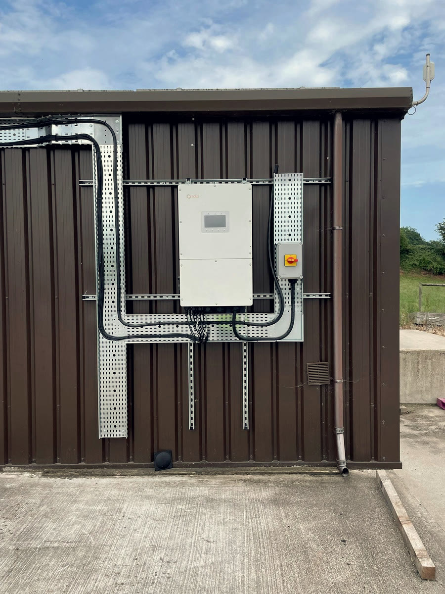 Solis commercial inverter installed with tidy cable tray runs on an agricultural building